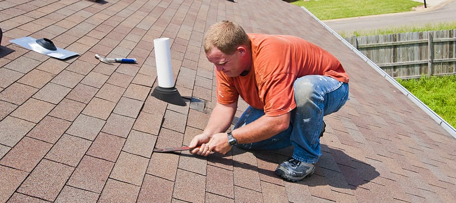 Big Dawgz Construction crew working on a home exterior